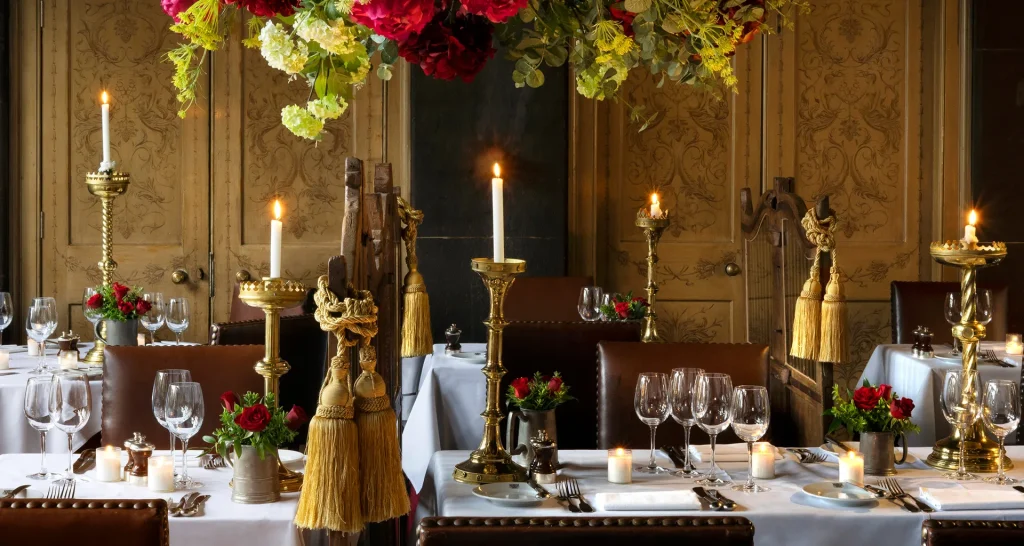 Candlelit table for two in an Edinburgh Old Town restaurant with tartan accents